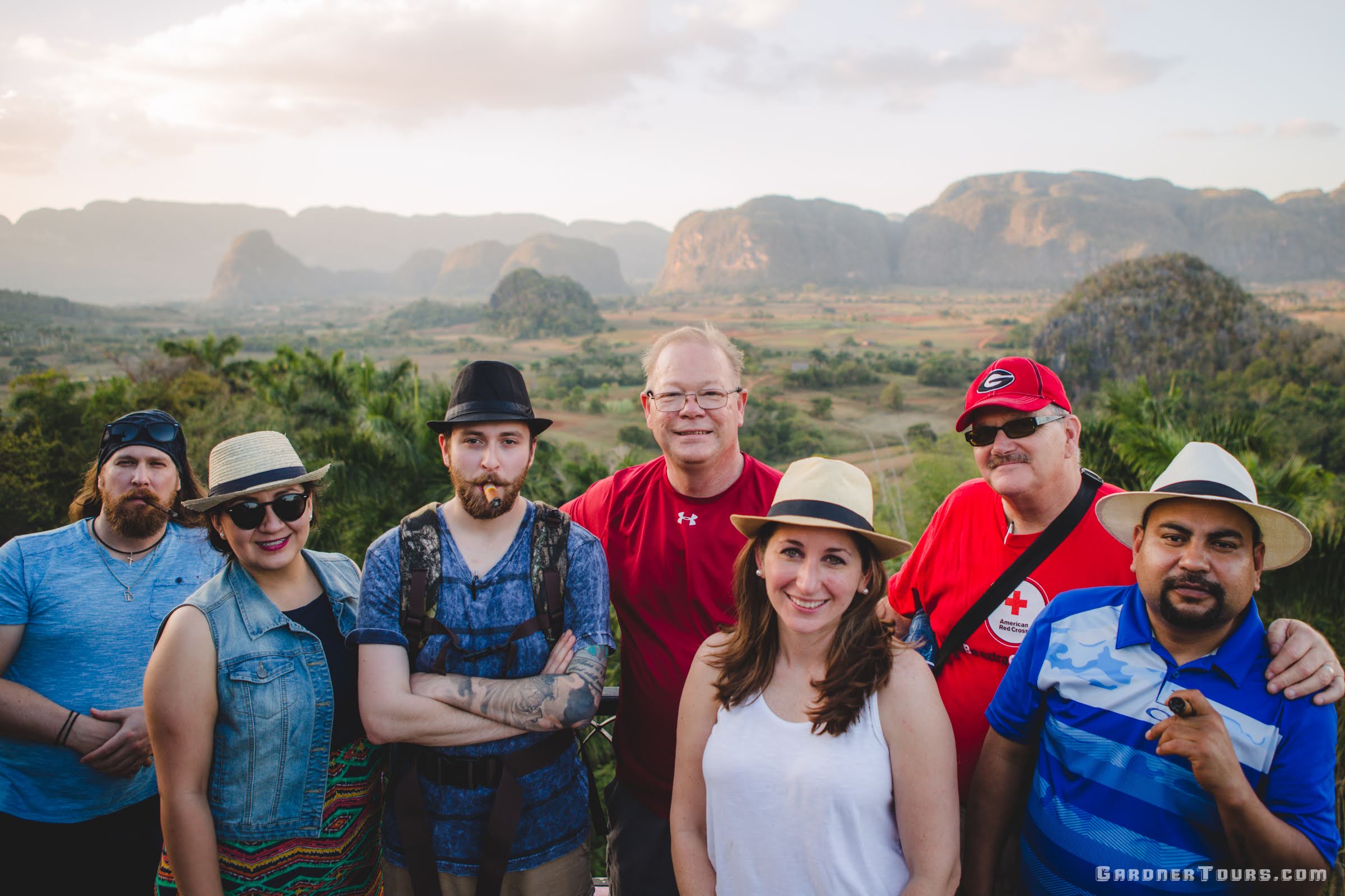 Group of Friends Smoking Cigars and Enjoying the View at the Los Jazmines Hotel Viewpoint overlooking the Vinales Valley in Cuba