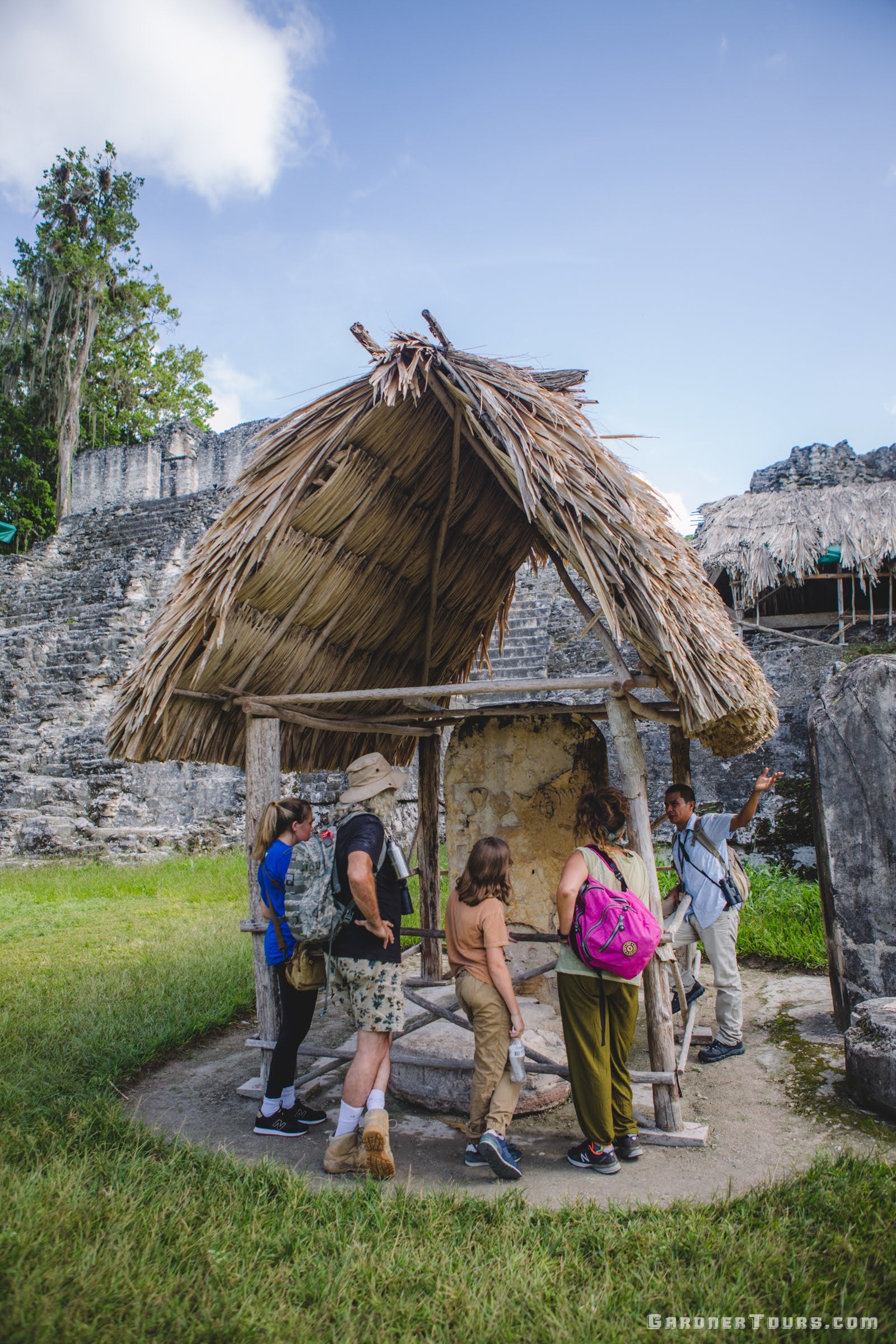 Family Learning About Mayan Rituals in Tikal National Park, Guatemala