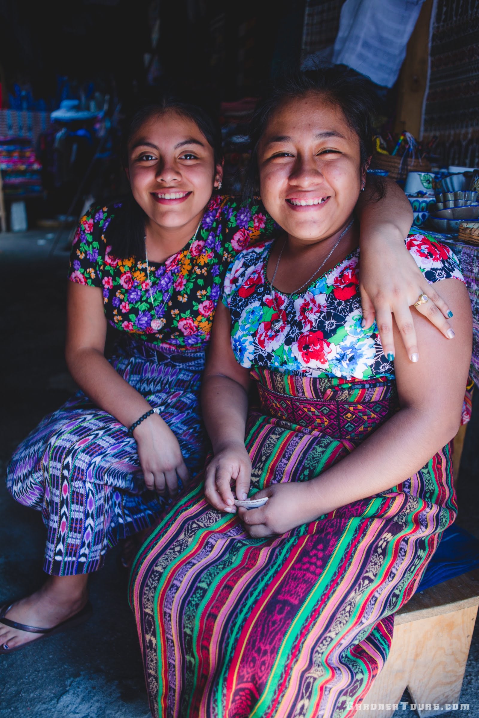 Two Mayan Girls Posing Together in their Traditional Clothing in San Juan La Laguna Lake Atitlan, Guatemala