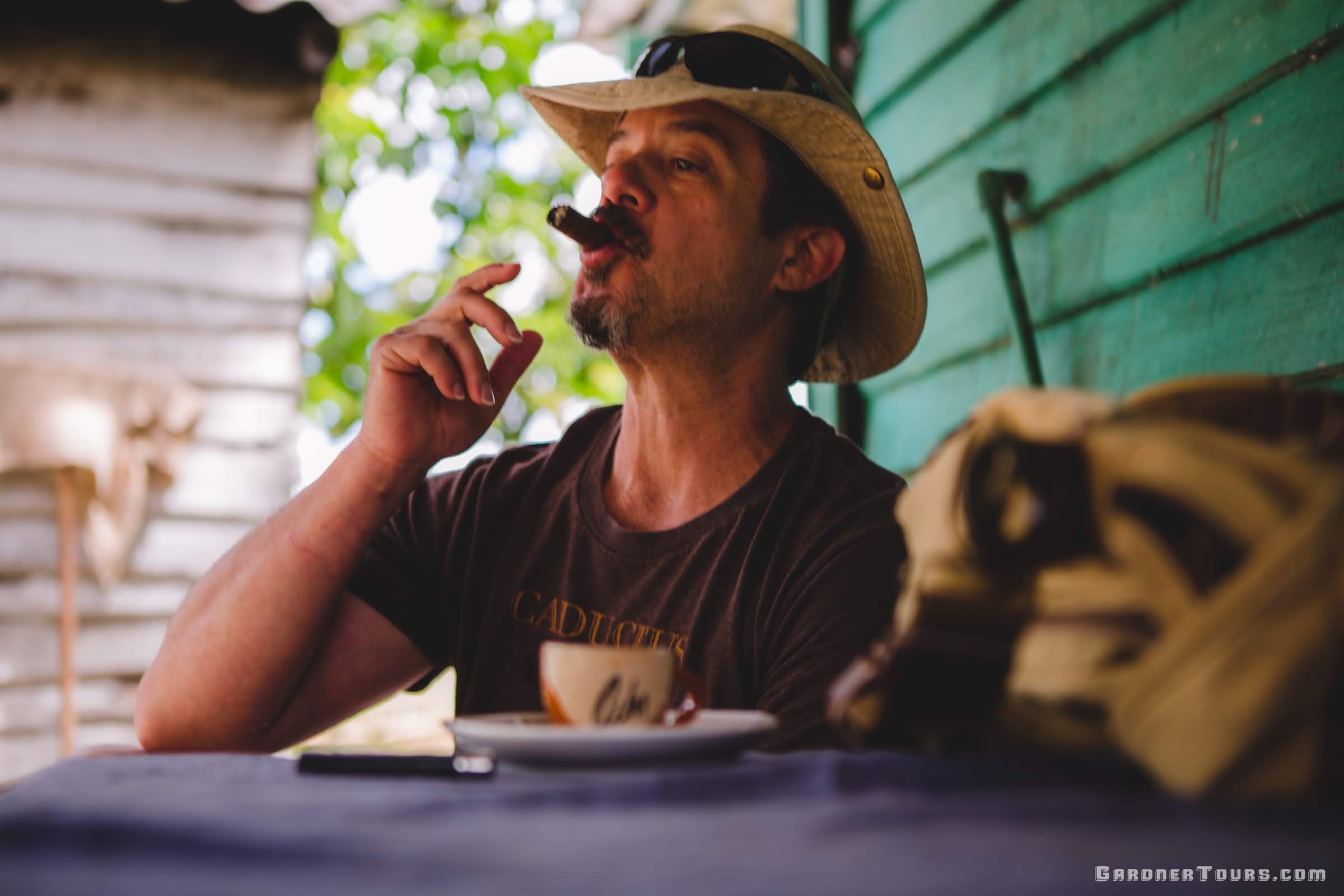 Man Smoking a Cigar and Enjoying a Cuban Coffee on a Farm in the Vinales Valley, Cuba